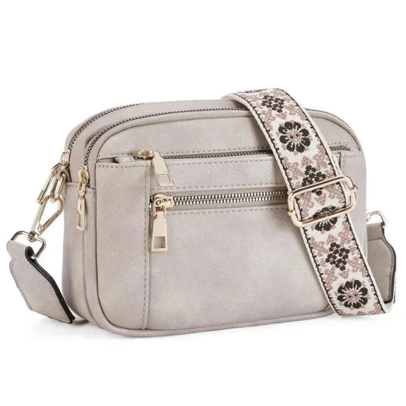 ARVIDA™ | CROSSBODY MED FARGERIKE STROPPER